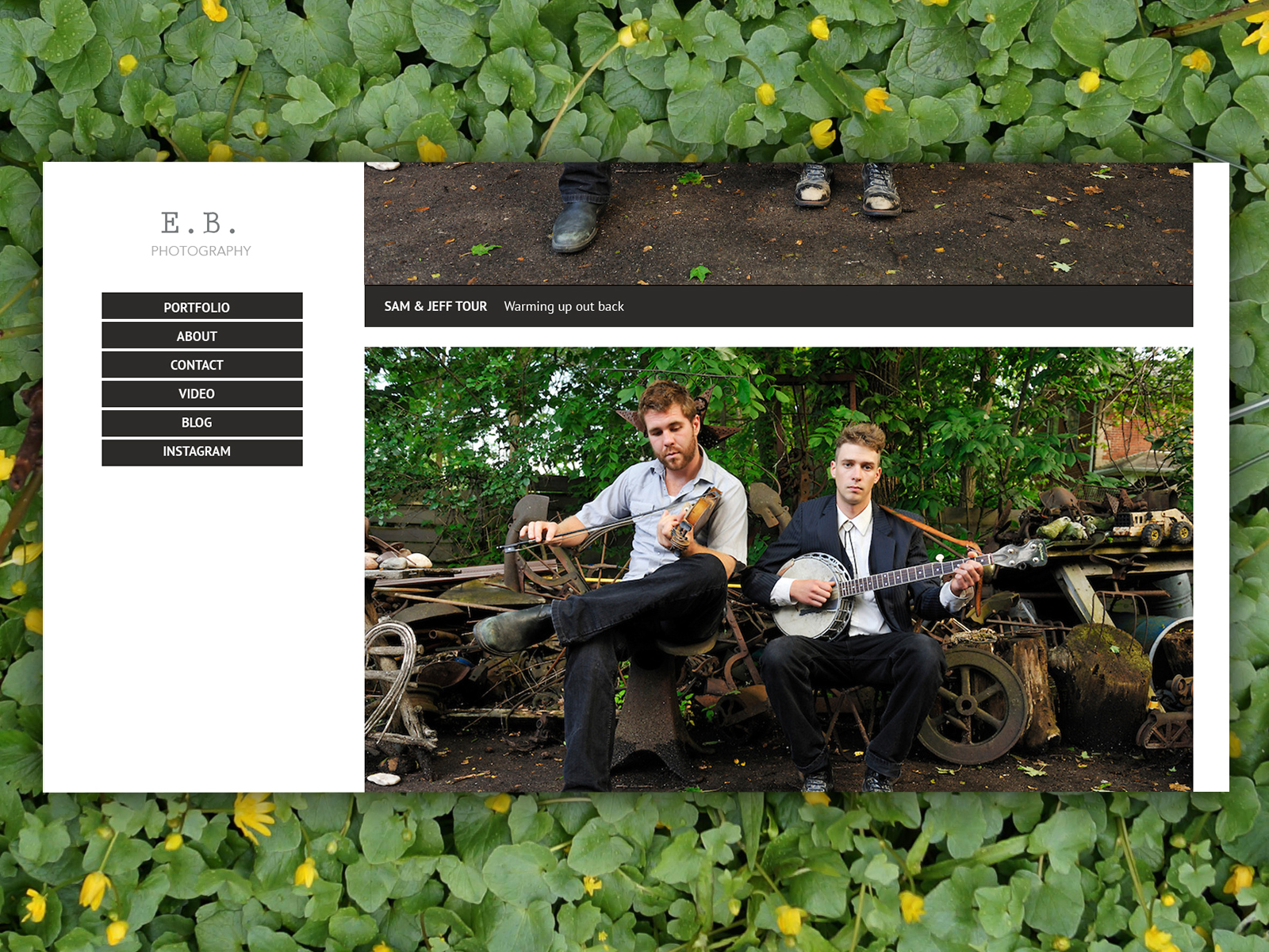 Photography portfolio with a left navigation and a collection of images in the center-right area. The portfolio image shows two musicians, one fiddler and another banjo player, playing outside, surrounded by junk. The entire portfolio is superimposed on a bed of plants.